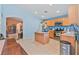 Modern kitchen with stainless steel appliances, island, and ample counter space at 11007 Vallerosa St, Las Vegas, NV 89141