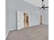 A bright bedroom with a ceiling fan and an open ensuite bathroom and walk-in closet at 1112 Bower Basin St, Las Vegas, NV 89144