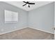 Bedroom featuring neutral carpet, a ceiling fan, and a window for natural light at 1112 Bower Basin St, Las Vegas, NV 89144