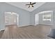 Spacious living area boasts neutral paint, arched doorways, and ample natural light at 1112 Bower Basin St, Las Vegas, NV 89144