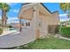 An expansive patio with column supports provides access to lush greenery and a refreshing swimming pool at 1112 Bower Basin St, Las Vegas, NV 89144