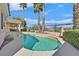 Enjoy this backyard pool area, landscaped with tall palm trees and complemented by desert views at 1112 Bower Basin St, Las Vegas, NV 89144