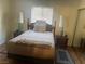 Neutral bedroom with natural lighting, wood furniture, and comfortable accents at 1112 Observation Dr # 102, Las Vegas, NV 89128