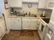 Practical kitchen with white appliances and cabinets at 1112 Observation Dr # 102, Las Vegas, NV 89128