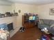 Comfortable living room with a fireplace, wooden floors, and a gray couch at 1112 Observation Dr # 102, Las Vegas, NV 89128