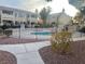 Community pool area with surrounding buildings, fencing and signage at 1112 Observation Dr # 102, Las Vegas, NV 89128
