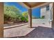 Open backyard patio with a covered area and brick pavers, perfect for entertaining and relaxation at 1427 Brushback Ave, Henderson, NV 89074