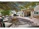 Inviting backyard patio featuring a built-in BBQ, fire pit, lounge seating, and covered area at 1427 Brushback Ave, Henderson, NV 89074