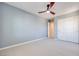 Bedroom with neutral carpet, fan, and closet space perfect for restful retreat at 1427 Brushback Ave, Henderson, NV 89074
