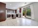 Open-concept kitchen featuring dark wood cabinets, granite countertops, and stainless steel appliances at 1427 Brushback Ave, Henderson, NV 89074