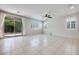 Open-concept space featuring tile floors and sliding glass doors leading to the patio at 1427 Brushback Ave, Henderson, NV 89074