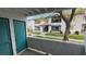 This balcony overlooks a well-maintained complex, with views of lush landscaping at 1455 E Katie Ave # 16, Las Vegas, NV 89119