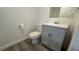 This bathroom features a toilet, modern vanity with sink, and wood-look flooring at 1455 E Katie Ave # 16, Las Vegas, NV 89119
