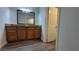 Bathroom vanity with cabinet storage, granite countertop and modern floors at 1455 E Katie Ave # 16, Las Vegas, NV 89119