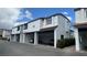 Condo exterior shows carports with parking, white facade, and red tile roofing at 1455 E Katie Ave # 16, Las Vegas, NV 89119
