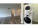 Living room featuring modern, stackable, front load washer and dryer at 1455 E Katie Ave # 16, Las Vegas, NV 89119