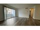 Living room shows balcony with sliding glass door and wood-look flooring at 1455 E Katie Ave # 16, Las Vegas, NV 89119