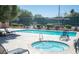 Community pool and spa with lounge chairs for sunny relaxation and outdoor enjoyment at 1455 E Katie Ave # 16, Las Vegas, NV 89119