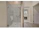 Modern bathroom featuring glass enclosed shower with custom tile work and accessibility features at 1546 Georgia Ave, Boulder City, NV 89005