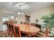 Bright dining room features a large wooden table and an open concept to a living space at 1546 Georgia Ave, Boulder City, NV 89005