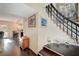 Inviting entryway featuring wood floors, staircase, and open access to the kitchen and living areas at 1546 Georgia Ave, Boulder City, NV 89005