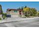 Inviting two-story home featuring a spacious driveway, mature trees and well-manicured front yard at 1546 Georgia Ave, Boulder City, NV 89005
