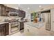 Modern kitchen with stainless steel appliances, granite countertops, and a center island at 1546 Georgia Ave, Boulder City, NV 89005