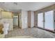 Bathroom features include tiled floors, a toilet, and french doors to the exterior at 1801 S 15Th St, Las Vegas, NV 89104