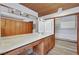 Bathroom with double vanity, wood ceiling, and large mirrors plus storage space at 1801 S 15Th St, Las Vegas, NV 89104