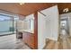 Bathroom with wood ceiling, vanity, and sink, plus a sliding glass door to the backyard at 1801 S 15Th St, Las Vegas, NV 89104