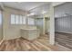 Well-lit bathroom featuring modern flooring, a glass shower, and window shutters at 1801 S 15Th St, Las Vegas, NV 89104