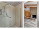 Accessible bathroom featuring a walk-in shower with grab bars and a peek into the open living space at 1801 S 15Th St, Las Vegas, NV 89104