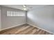 Bedroom featuring modern flooring, a ceiling fan, modern window shutters and ample natural light at 1801 S 15Th St, Las Vegas, NV 89104