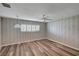 Spacious bedroom featuring modern flooring, a ceiling fan, modern window shutters and ample natural light at 1801 S 15Th St, Las Vegas, NV 89104