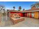 Unique courtyard featuring a rock water feature, decorative brickwork, and stylish access to the house at 1801 S 15Th St, Las Vegas, NV 89104