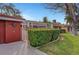 Charming single-story home with a well-manicured lawn and mature landscaping and a red tone at 1801 S 15Th St, Las Vegas, NV 89104