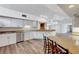 Spacious kitchen features white cabinets, granite countertops, stainless steel appliances, and a large island with seating at 1801 S 15Th St, Las Vegas, NV 89104
