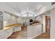 Well-lit kitchen featuring white cabinets, granite countertops, stainless steel appliances, and wood flooring at 1801 S 15Th St, Las Vegas, NV 89104