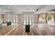 Bright, open living room with hardwood floors, grand windows, and access to the outdoor area at 1801 S 15Th St, Las Vegas, NV 89104