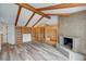 Spacious living room with vaulted ceilings, exposed beams, fireplace, and custom built-ins offer ample storage space at 1801 S 15Th St, Las Vegas, NV 89104