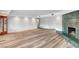 Bright living room featuring a unique green fireplace, wood flooring and recessed lighting at 1801 S 15Th St, Las Vegas, NV 89104