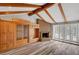 Cozy living room boasts a fireplace, exposed wood beams, and built-in cabinets for storage at 1801 S 15Th St, Las Vegas, NV 89104