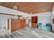 Living room with wood ceiling and floors, large glass sliding doors and a built-in cabinet at 1801 S 15Th St, Las Vegas, NV 89104