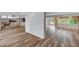 Open-concept living area with stylish wood floors, seamlessly connecting the kitchen and dining spaces for modern living at 1801 S 15Th St, Las Vegas, NV 89104