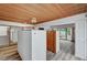 Main bedroom with wood ceiling, dressing area, sliding glass doors and storage space at 1801 S 15Th St, Las Vegas, NV 89104