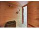 Sauna features wood paneled walls, clocks, and view to bathroom at 1801 S 15Th St, Las Vegas, NV 89104