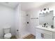 Bathroom featuring shower, toilet, vanity, modern fixtures, and a decorative plant at 1891 Brian Rd, Pahrump, NV 89048