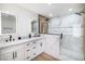 Elegant bathroom with double vanity, modern lighting, and a glass-enclosed shower at 1891 Brian Rd, Pahrump, NV 89048