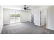Bright bedroom featuring a sliding glass door and closet, offering plenty of natural light at 1891 Brian Rd, Pahrump, NV 89048