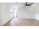 Spacious bedroom with ample natural light, wood-look floors, and a ceiling fan at 1891 Brian Rd, Pahrump, NV 89048